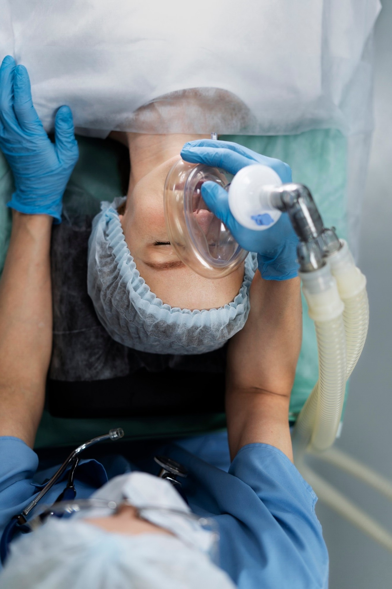 nurse-putting-oxygen-mask-patient_23-2149372301